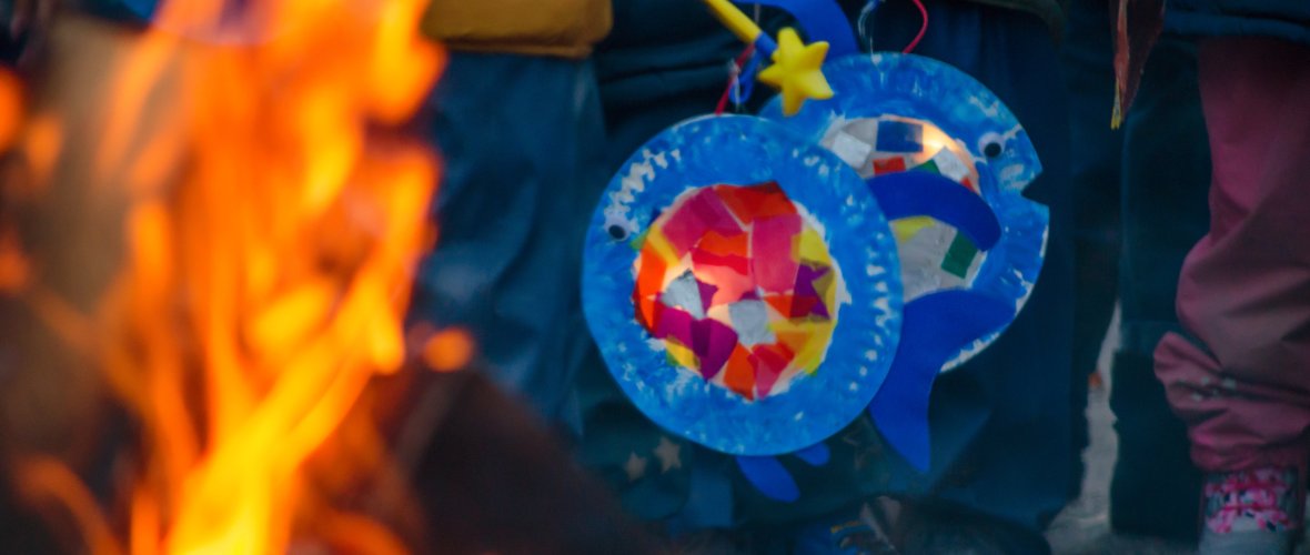 sankt martin day, bonfire and children with lantern defocused